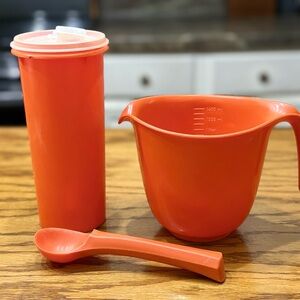 Vintage orange 70s Tupperware lot with measuring cup/bowl and scoop